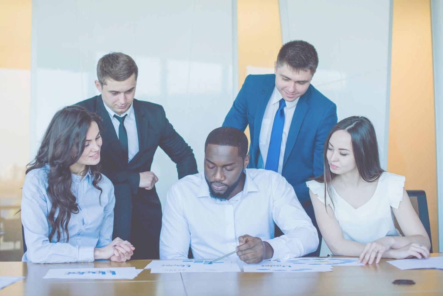 Professional reviewing financial reports and budget documents
